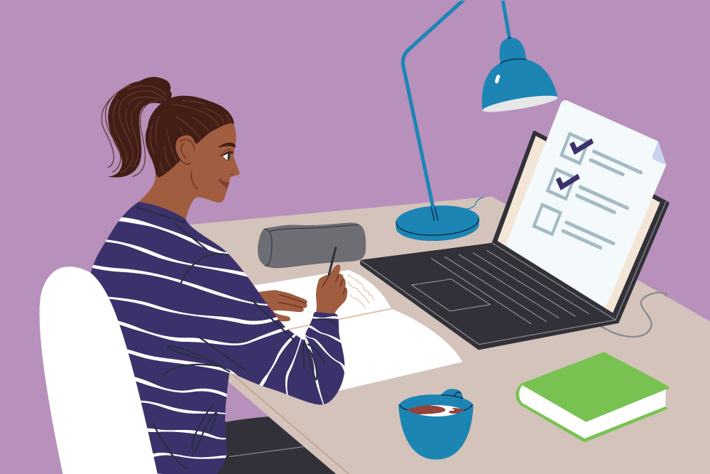 Woman working at a desk with a paper and laptop