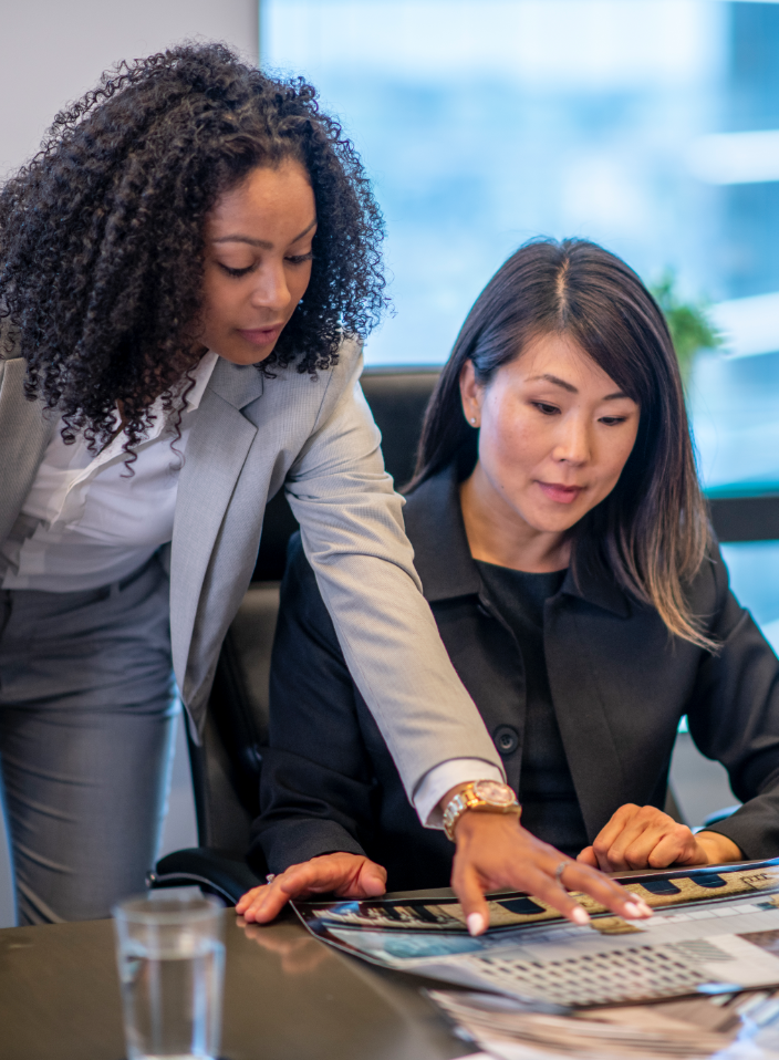 team members reviewing work
